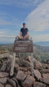 Nicus Employee at Summit of Mountain